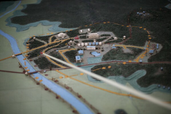 FILE - A model of the Demilitarized Zone, DMZ, that separates the two halves of the Korean peninsula is displayed near Kaesong, North Korea, on Sept. 18, 2008. A series of low-slung buildings and somber soldiers dot the landscape of the DMZ, the swath of land between North and South Korea where a soldier on a tour crossed into North Korea on Tuesday, July 18, 2023, under circumstances that remain unclear. (AP Photo/David Guttenfelder, File)
