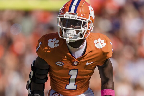 FILE - Clemson safety Andrew Mukuba plays against Syracuse during an NCAA college football game Oct. 22, 2022, in Clemson, S.C. Former Clemson safety Mukuba has announced he is transferring to Texas, his hometown school. (AP Photo/Jacob Kupferman, File)