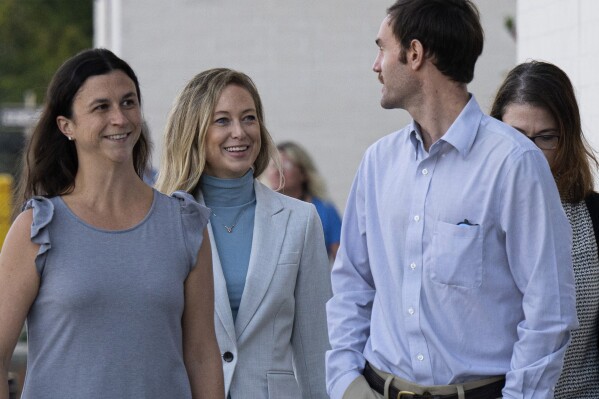 Molly Corbett, second left, arrives with family at the Davidson County Courthouse, Monday, Oct. 30, 2023, in Lexington, N.C., for a hearing before her retrial in the murder of Jason Corbett. (Walt Unks/The Winston-Salem Journal via AP)