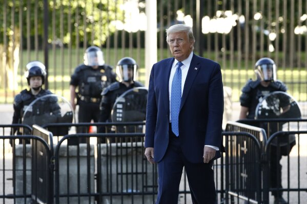 President Donald Trump walks in Lafayette Park to visit outside St. John's Church across from the White House Monday, June 1, 2020, in Washington. Part of the church was set on fire during protests on Sunday night. (AP Photo/Patrick Semansky)