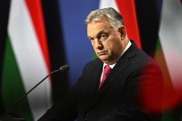 FILE - Hungarian Prime Minister Viktor Orban arrives for an annual international press conference in Budapest, Hungary, Thursday, Dec. 21, 2023. Nearly two years after Sweden formally applied to join NATO, its membership now hinges on convincing one country, Viktor Orb谩n's Hungary to formally ratify its bid to join the military alliance. (APPhoto/Denes Erdos, File)