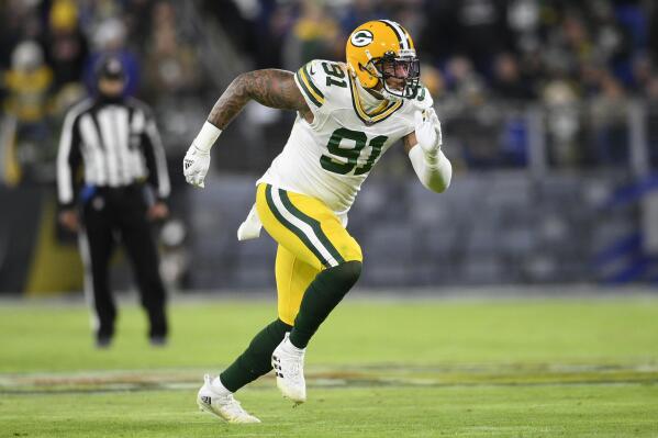 FILE - Green Bay Packers outside linebacker Preston Smith (91) in action in the first half of an NFL football game against the Baltimore Ravens, Sunday, Dec. 19, 2021, in Baltimore. (AP Photo/Nick Wass, File)