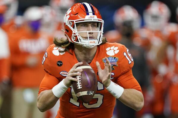 FILE - Clemson quarterback Trevor Lawrence passes against Ohio State during the first half of the Sugar Bowl NCAA college football game in New Orleans, Friday, Jan. 1, 2021. About the only certainty in the confounding 2021 NFL draft is Trevor Lawrence going to the Jaguars with the first overall pick Thursday night in Cleveland. This year's NFL draft is like none other because teams weren't able to meet face-to-face with the pool of prospects outside the lucky few who got to play in the Senior Bowl after a season that was marked by opt outs and cancellations. (AP Photo/John Bazemore, File)