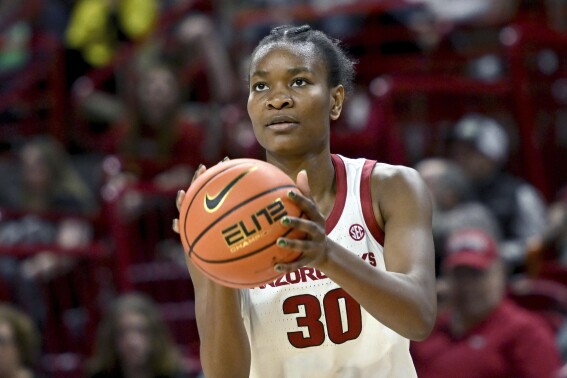 FILE - Arkansas forward Maryam Dauda (30) shoots during an NCAA basketball game against LSU, Thursday, Dec. 29, 2022, in Fayetteville, Ark. Dauda to its national championship roster. Dauda, who is 6-foot-4, spent the past three seasons with the Razorbacks. She announced her commitment to the Gamecocks on social media Wednesday, May 29, 2024. (AP Photo/Michael Woods, File)