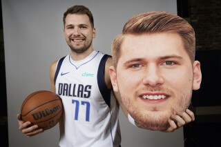 Doncic returns to Spain to warm welcome from former club Real Madrid in  preseason game with Mavs | AP News