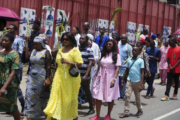 Catholic faithful march carrying Palm fronds to celebrate Palm Sunday, on the streets of Lagos, Nigeria, Sunday, April 13, 2025. (AP Photo/Sunday Alamba)