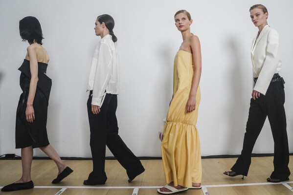 Fashion from Proenza Schouler collection is modeled backstage pre-show, during Fashion Week, Saturday, Sept. 9, 2023 in New York. (AP Photo/Bebeto Matthews)