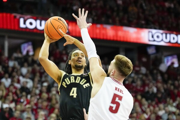 Purdue's Trey Kaufman-Renn (4) shoots against Wisconsin's Tyler Wahl (5) during the first half of an NCAA college basketball game Sunday, Feb. 4, 2024, in Madison, Wis. (AP Photo/Andy Manis)