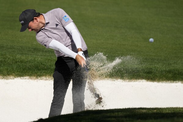 Nick Taylor, of Canada, hits out of a fairway bunker on the second hole during the final round of the Phoenix Open golf tournament Sunday, Feb. 11, 2024, in Scottsdale, Ariz. (APPhoto/Ross D. Franklin)
