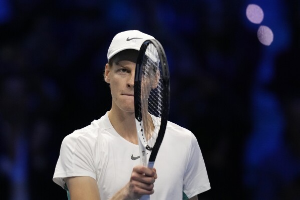 Italy's Jannik Sinner celebrates after winning the singles tennis match against Denmark's Holger Rune, of the ATP World Tour Finals at the Pala Alpitour, in Turin, Italy, Thursday, Nov. 16, 2023. (AP Photo/Antonio Calanni)