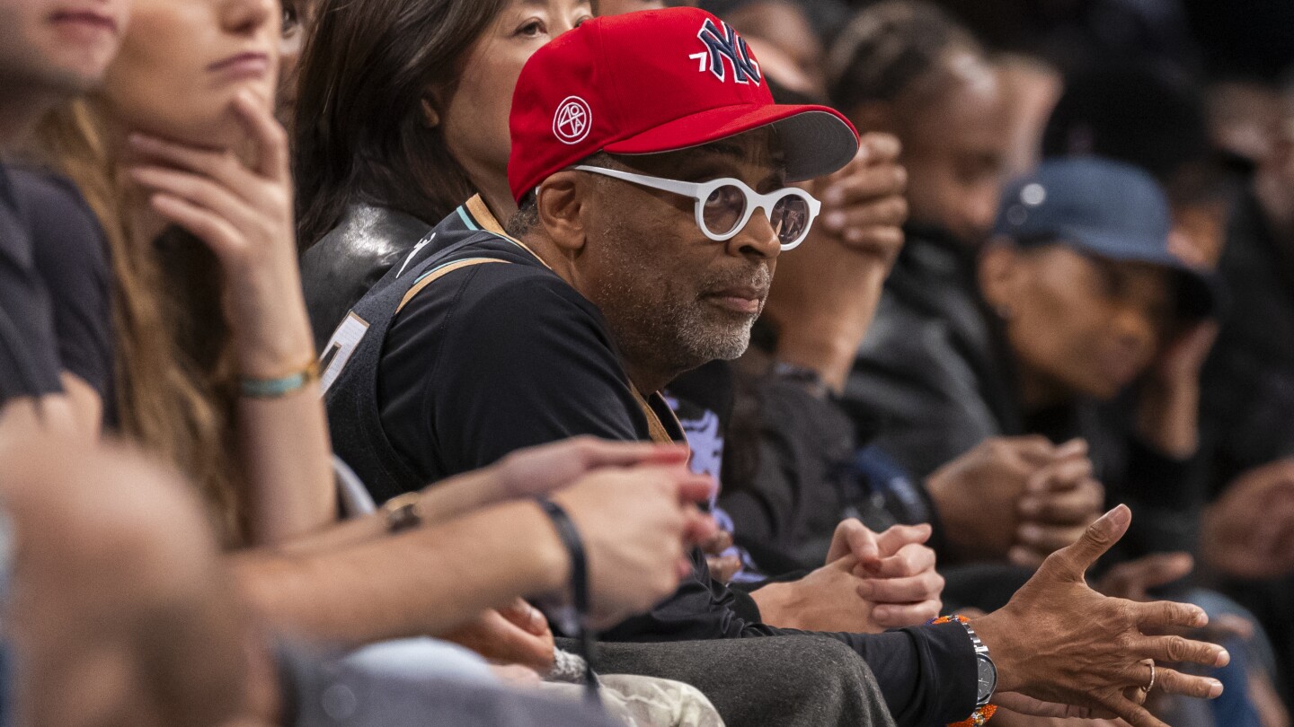 Basketball superfan Spike Lee attends the Liberty playoff game wearing a Sabrina Ionescu jersey