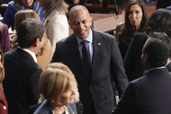 House Minority Leader Hakeem Jeffries, D-N.Y., speaks with members as the House of Representatives meets to elect a speaker and convene the new 119th Congress at the Capitol in Washington, Friday, Jan. 3, 2025. (AP Photo/Jacquelyn Martin)
