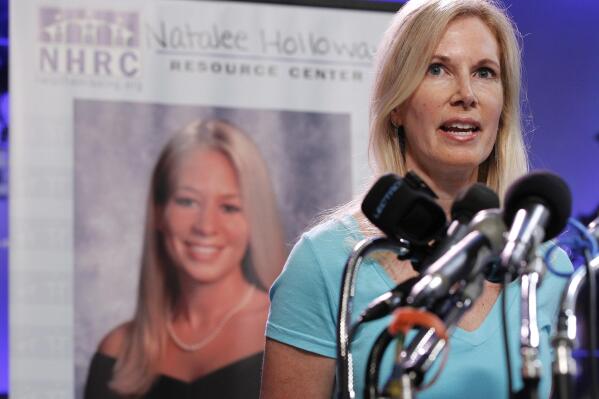 FILE - Beth Holloway, mother of Natalee Holloway, speaks during the opening of the Natalee Holloway Resource Center (NHRC) at the National Museum of Crime & Punishment in Washington, June 8, 2010. Natalee, 18, of Mountain Brook, Alabama, vanished while on a high school graduation trip to Dutch-owned Aruba, an island in the Caribbean in 2005. She never showed up for a flight home and her disappearance made international headlines. (AP Photo/Pablo Martinez Monsivais, File)