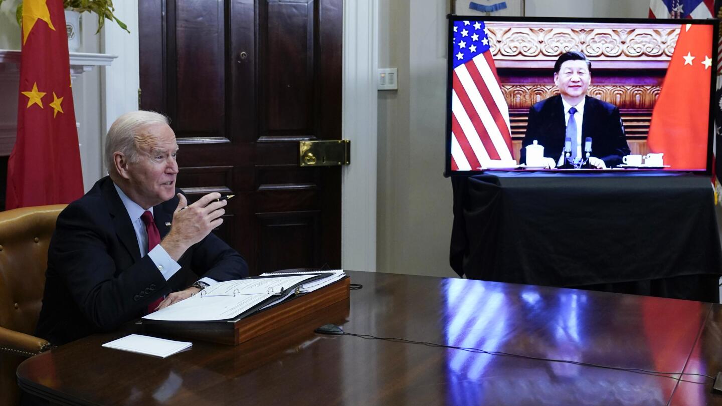 Biden, Xi try to tamp down tension in long virtual meeting