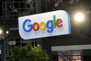 FILE - The Google logo is seen at the Vivatech show in Paris in Paris, France, Wednesday, June 14, 2023. France's competition watchdog hit Google on Wednesday March 20, 2024 with another big fine in settling a long-running dispute centered on payments to French publishers for their news. (AP Photo/Thibault Camus, File)