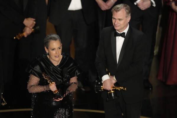 Emma Thomas, left, and Christopher Nolan accept the award for best picture for "Oppenheimer" during the Oscars on Sunday, March 10, 2024, at the Dolby Theatre in Los Angeles. (AP Photo/Chris Pizzello)