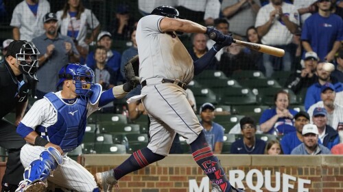 Cleveland Guardians' Josh Naylor hits a two-run single against the Chicago Cubs during the 10th inning of a baseball game, Sunday, July 2, 2023, in Chicago. (AP Photo/David Banks)