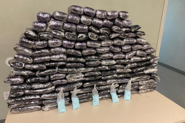 This undated photo provided by the U.S. Drug Enforcement Administration, Los Angeles Field Division, shows some of the seized approximately 1 million fake pills containing fentanyl that were seized when agents served a search warrant, July 5, 2022, at a home in Inglewood, Calif. (DEA via AP)