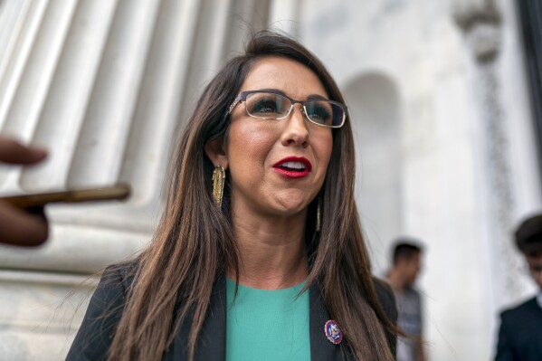 FILE - Rep. Lauren Boebert, R-Colo., leaves the chamber at the Capitol in Washington, June 21, 2023. Fleeing a tough reelection bid in the district where she lives, Boebert is moving from the mountains to the plains, in the hopes of finding conservative pastures green enough to salvage her place in Congress. (AP Photo/J. Scott Applewhite, File)