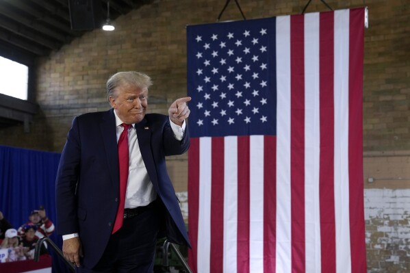 Former President Donald Trump arrives at a commit to caucus rally, Saturday, Oct. 7, 2023, in Waterloo, Iowa. (AP Photo/Charlie Neibergall)