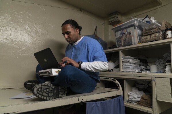 Gerald Massey, an incarcerated student majoring communications through the Transforming Outcomes Project at Sacramento State (TOPSS), studies in his cell at Folsom State Prison in Folsom, Calif., Wednesday, May 3, 2023. Many more prisoners like Massey will have opportunities to leave prison with bachelor's degrees, when new federal rules on financial aid for higher education take effect in July. (AP Photo/Jae C. Hong)