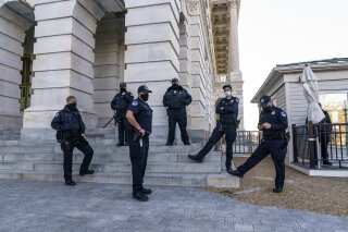 Heightened security remains around the U.S. Capitol since the Jan. 6 attacks by a mob of supporters of then-President Donald Trump, in Washington, Wednesday, March 3, 2021. The U.S. Capitol Police say they have intelligence showing there is a "possible plot" by a militia group to breach the U.S. Capitol on Thursday. (AP Photo/J. Scott Applewhite)