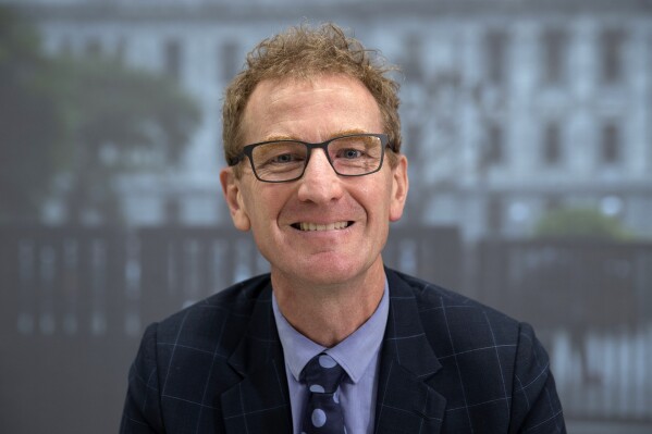 Andrew Hampton, New Zealand's Director-General of the Government Communications Security Bureau poses for a photo at Defence House in Wellington, on March 23, 2022. China, Iran and Russia are engaged in foreign interference in New Zealand, the nation's domestic intelligence agency said Friday, Aug. 11, 2023, after making its threat assessment report public for the first time. (Mark Mitchell/New Zealand Herald via AP)