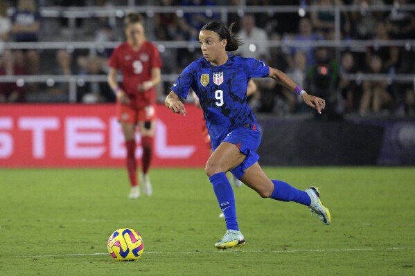 FILE - U.S. forward Mallory Swanson (9) controls the ball during the second half of a SheBelieves Cup women's soccer match against Canada, Thursday, Feb. 16, 2023, in Orlando, Fla. The Chicago Red Stars have signed U.S. national team forward Mallory Swanson to a historic four-year contract with an option for a fifth year, a record for the National Women's Soccer League. Financial terms of the deal announced Tuesday, Jan. 16, 2024, were not made public, although the team called it the “most lucrative agreement” in league history. (AP Photo/Phelan M. Ebenhack)