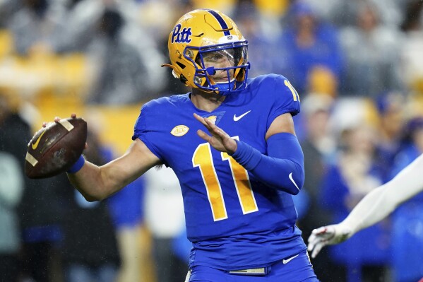 Pittsburgh quarterback Christian Veilleux looks for a receiver during the first half of the team's NCAA college football game against Louisville in Pittsburgh, Saturday, Oct. 14, 2023. (AP Photo/Matt Freed)