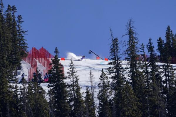 FILE - A skier competes in the World Cup downhill race in this Dec. 4, 2021, in Beaver Creek, Colo. Olympic athletes in Alpine skiing and other outdoor sports dependent on snow are worried as they see winters disappearing. (AP Photo/Robert F. Bukaty, File)