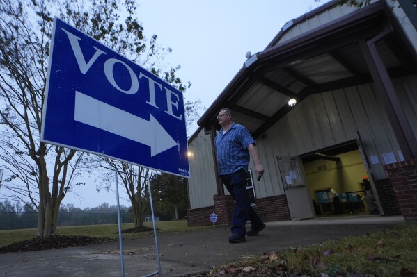 A voter leaves a polling ___location after voting Tuesday, Nov. 5, 2024 in Rutledge, Ga. (AP Photo/John Bazemore, File)