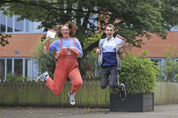 Head girl, Mirran Morrison and Head boy Chris Cassells receive their A-level results at Lagan College, in Belfast, Thursday Aug. 17, 2023. For hundreds of thousands of final year high school students across the U.K., Thursday has been a day of high emotion as they found out how they did in exams that will largely determine what they will be doing over the coming few years. (Liam McBurney/PA via AP)