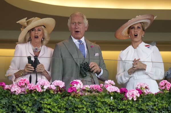 Britain's King Charles III, Camilla, the Queen Consort and Sophie, Duchess of Edinburgh, right, react as they watch a race at day two of the Royal Ascot horse racing meeting, at Ascot Racecourse in Ascot, England, Wednesday, June 21, 2023. (AP Photo/Alastair Grant)