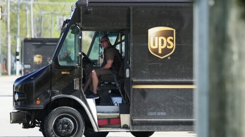 A UPS truck makes deliveries in Northbrook, Ill., Wednesday, May 10, 2023. Unionized UPS workers voted overwhelmingly on Friday, June 16, to authorize a strike, setting the stage for a potential work stoppage if the package delivery company and Teamsters can’t come to an agreement before their contract expires next month.(AP Photo/Nam Y. Huh)