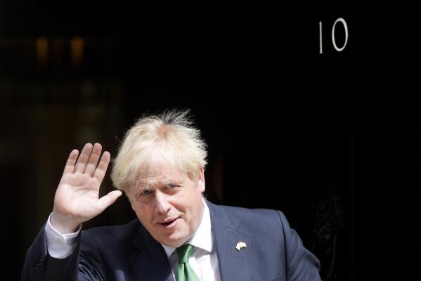 Britain's Prime Minister Boris Johnson leaves 10 Downing Street to attend the weekly Prime Ministers' Questions session in parliament in London, Wednesday, July 13, 2022. (AP Photo/Frank Augstein)