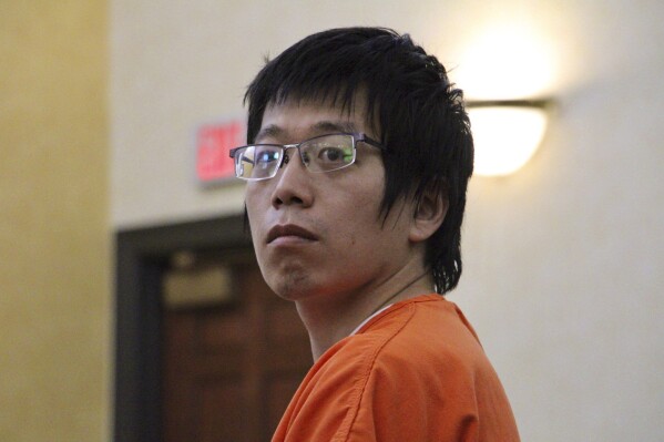 Tailei Qi, the graduate student suspected in the fatal shooting of a University of North Carolina at Chapel Hill faculty member, makes his first appearance at the Orange County Courthouse in Hillsborough, N.C., Tuesday, Aug. 29, 2023. Qi has been charged by the UNC Police Department with first-degree murder and possession of a weapon on educational property, both felony charges. (AP Photo/Hannah Schoenbaum)