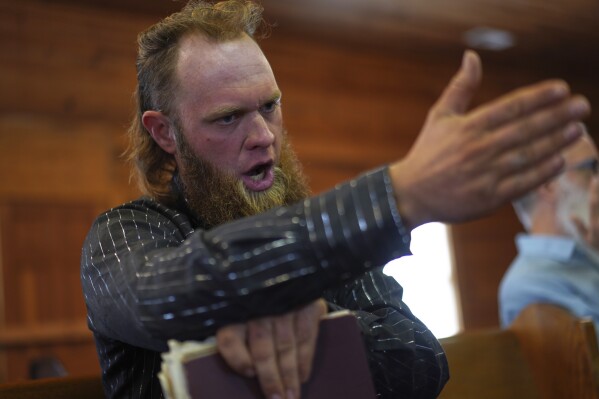 Isaac Green, 34, sings in the tenor section during a Sacred Harp singing event at Holly Springs Primitive Baptist Church in Bremen, Ga., on Sunday, March 23, 2025. (AP Photo/Jessie Wardarski)