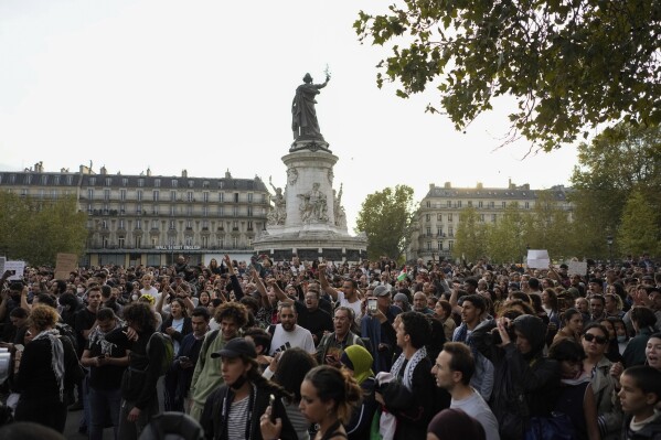Protestors chant slogans during a rally in solidarity with the Palestinian people in Gaza, in Paris, Thursday, Oct.12, 2023. (AP Photo/Thibault Camus)