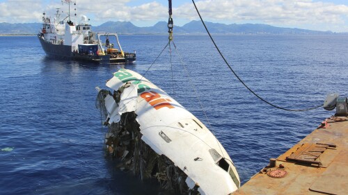 FILE - In this photo provided by the National Transportation Safety Board, the forward section of the fuselage of TransAir flight 810 is recovered from the Pacific Ocean near Honolulu on Oct. 20, 2021. Federal investigators said Thursday, June 15, 2023, that the cargo plane ditched into the ocean off Hawaii in 2021 was because pilots identified the wrong engine that was failing and didn’t have enough power to remain airborne. (Clint Crookshanks/National Transportation Safety Board via AP, File)