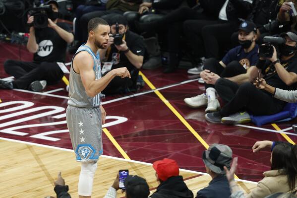 Golden State Warriors' Stephen Curry engages with the fans during the second half of the NBA All-Star basketball game, Sunday, Feb. 20, 2022, in Cleveland. (AP Photo/Ron Schwane)