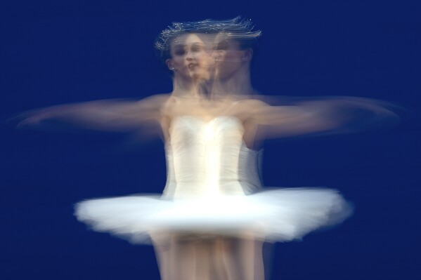 American Ballet Theater's ballerina Devon Teuscher rehearses for a performance at the Shanghai Grand Theater in Shanghai, Thursday, Nov. 2, 2023. The American national ballet company is returning to China for the first time in a decade for shows in Shanghai and Beijing in the latest sign strained relations between the United States and China are beginning to thaw. (AP Photo/Ng Han Guan)