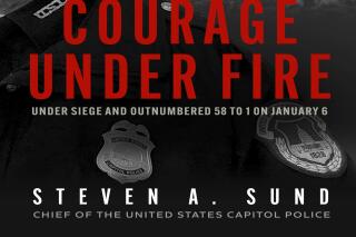 This cover image released by Blackstone Publishing shows "Courage Under Fire: Under Siege and Outnumbered 58 to 1 on January 6" by Steven A. Sund. (Blackstone Publishing via AP)