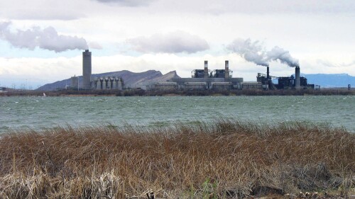 FILE - The Four Corners Power Plant in Waterflow, N.M., near the San Juan River in northwestern New Mexico, is viewed in April 2006. The New Mexico Supreme Court on Thursday, July 6, 2023, affirmed a decision by utility regulators who rejected a proposal by the state’s largest electric provider to transfer shares in a coal-fired power plant to a Navajo energy company. (AP Photo/Susan Montoya Bryan, File)