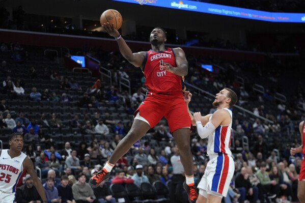 New Orleans Pelicans forward Zion Williamson (1) drives on Detroit Pistons guard Malachi Flynn (14) in the second half of an NBA basketball game in Detroit, Sunday, March 24, 2024. (AP Photo/Paul Sancya)