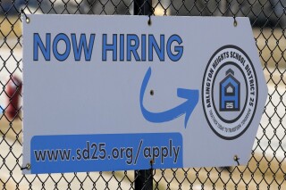 A hiring sign is displayed in Arlington Heights, Ill., Monday, Feb. 26, 2024. On Thursday, March 21, 2024, Freddie Mac reports on this week's average U.S. mortgage rates. (AP Photo/Nam Y. Huh)