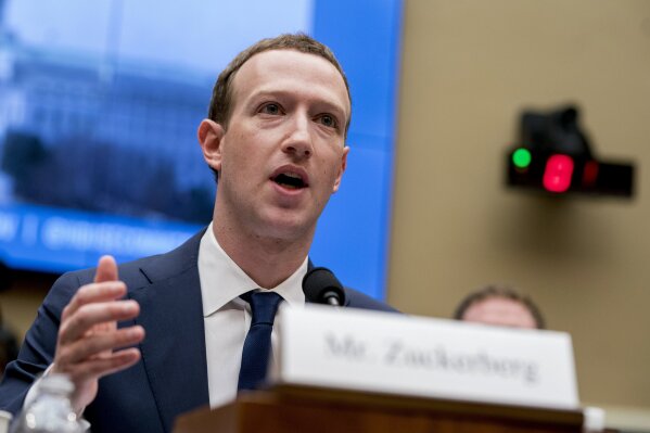 FILE - In this April 11, 2018, file photo, Facebook CEO Mark Zuckerberg testifies before a House Energy and Commerce hearing on Capitol Hill in Washington about the use of Facebook data to target American voters in the 2016 election and data privacy. Zuckerberg will be in Washington Thursday, Sept. 19, 2019, to meet with lawmakers and talk about internet regulation. The company said the meetings are not public and it did not give details on whom Zuckerberg is meeting with and what, exactly, he'll discuss. (AP Photo/Andrew Harnik, File)