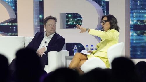 FILE - Twitter CEO Elon Musk, center, speaks with Linda Yaccarino, chairman of global advertising and partnerships for NBC, at the POSSIBLE marketing conference, Tuesday, April 18, 2023, in Miami Beach, Fla. Musk announced Friday, May 12, 2023, that he's hiring Yaccarino to be the new CEO of San Francisco-based Twitter, which is now called X Corp. (AP Photo/Rebecca Blackwell, File)