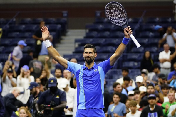 Novak Djokovic, of Serbia, celebrates winning his match against Alexandre Muller, of France, during the first round of the U.S. Open tennis championships, Tuesday, Aug. 29, 2023, in New York. (AP Photo/Frank Franklin II)