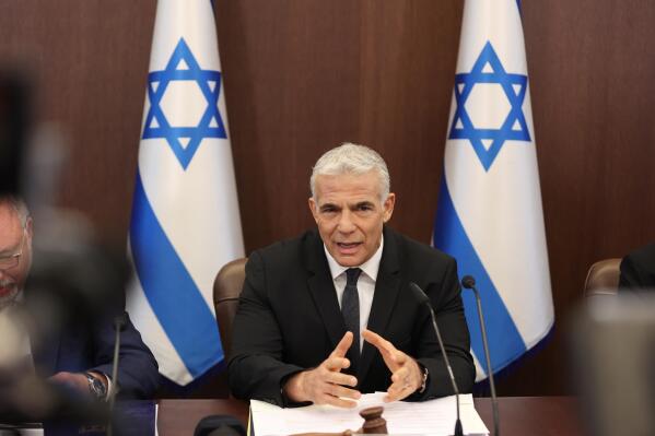 FILE - Israeli Prime Minister Yair Lapid attend the cabinet meeting at the prime minister's office in Jerusalem, Sept. 4, 2022.  Lapid on Wednesday, Sept 7,  said no one would “dictate our open-fire policies," appearing to reject U.S. calls for Israel to review its rules of engagement following the shooting death of a prominent journalist.  The State Department has said it will press Israel to review its policies after the death of Al Jazeera journalist Shireen Abu Akleh in May.  (Abir Sultan/Pool Photo via AP, File)