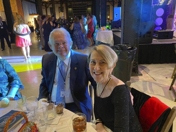This photo shows Don and Margie Varnadoe attending a March 2021 awards banquet in Savannah, Ga., for the real estate office where Don Varnadoe worked. The husband and wife from St. Simons Island, Ga.,were among three people killed when an Amtrak train derailed in Montana on Saturday, Sept. 25, 2021.   (Photo courtesy of Robert Kozlowski via AP)